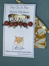 Load image into Gallery viewer, Pop On A Few "Precious" - 9mm Stitch Markers, Blue/Brown/Green Goldstone Beads