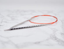 Load image into Gallery viewer, AddiNovel square circular fixed lace needles coiled up on marble surface, close-up