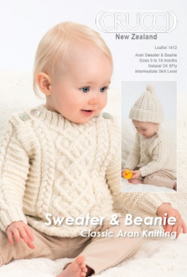 Baby's sweater and beanie pattern cover, aran style cables with two buttons on each shoulder of jumper