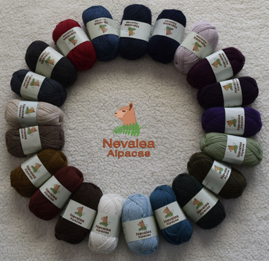 Nevalea alpaca 4ply yarn laid out in a ring formation; full colour range.
