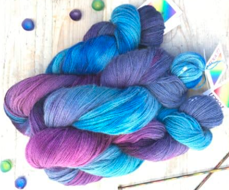 Touch Yarns 2ply Hand-Painted Merino, Possum & Silk yarn in Peacock variant of purples and lilacs through to cornflower and sky blue shades.