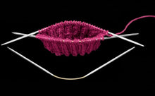 Load image into Gallery viewer, Addi CraSyTrio Needle short set with small piece of pink ribbed knitting on two needles

